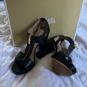 Black Berkley heals in black. Size 7.5 worn out once for a wedding.